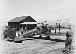 A No. 10 Local Air Supply Unit Tiger Moth aircraft following the Japanese surrender