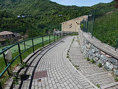 The pathways connecting to the building.