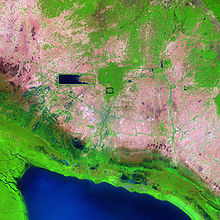 A satellite image of Angkor. The dried East Baray indicates environmental changes in the region. Angkor Ruins from Space.jpg