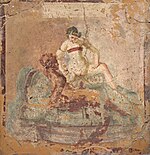 Wall painting from Pompeii depicting the "woman riding" position, a favorite in Roman art: even in explicit sex scenes, the woman's breasts are often covered. Fragment of wall painting with erotic scene, from Pompeii, Naples National Archaeological Museum (17297820526).jpg