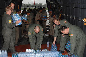 US Air Force personnel deliver relief supplies...