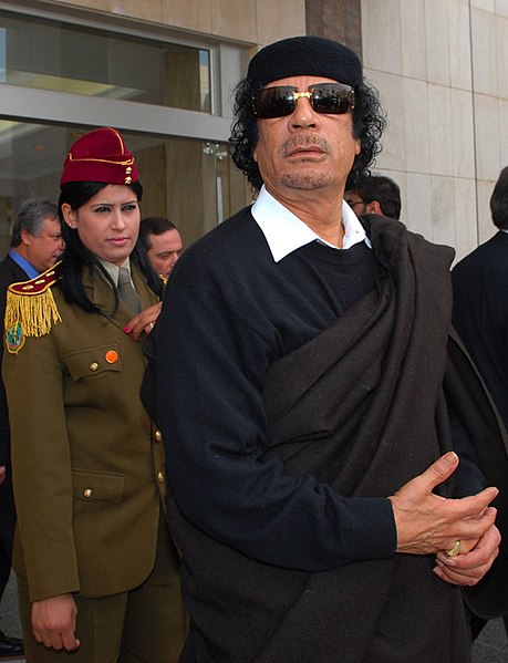 http://upload.wikimedia.org/wikipedia/commons/thumb/e/e5/Muammar_Abu_Minyar_al-Gaddafi_in_Dimashq%2C_Syria.jpg/459px-Muammar_Abu_Minyar_al-Gaddafi_in_Dimashq%2C_Syria.jpg