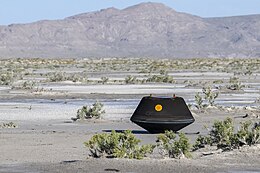 The sample return capsule from NASA's OSIRIS-REx mission shortly after touching down in the desert in Utah OSIRIS-REx Sample Return (NHQ202309240003).jpg