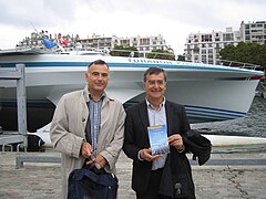 Louis Boisgibault (left), author of academic books on energy transition, meets crew.