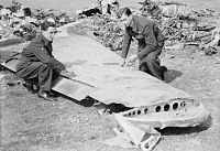 Pilot Officer J Allen (right) and Flight Sergeant W Patterson, 96 Squadron, survey the wreckage of a Ju 88A-4. It belonged to 6. Staffel of KG 6. The machine was code 3E+BP Werknummer 2537. Unteroffizier Helmut Barbauer and Friedrich Schork were taken prisoner. Hugo Muhlbauer and Fritz Gotze were killed. Royal Air Force 1939-1945- Fighter Command CH12788.jpg