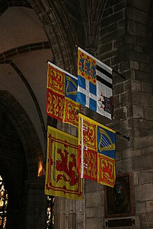 Royal Banners in St Giles' Cathedral: The Royal Standard of the United Kingdom used in Scotland and (clockwise) those of the Duke of Edinburgh, Princess Royal and Duke of Rothesay. Royal banners St Giles Edinburgh.jpg