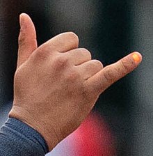 Ali Sanchez's orange-painted fingernail during a 2022 game for the Toledo Mud Hens Ali Sanchez fingernail (52200180973) (cropped).jpg