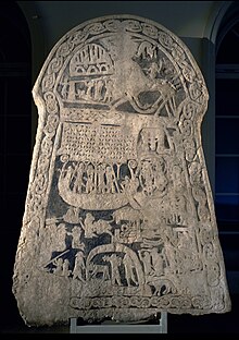 A 9th-century picture stone from Ardre, Gotland that may depict Valhalla on the upper left. The figure on the eight-legged horse may depict Odin or a dead warrior riding to Valhalla. Bildstenen Volundstenen.jpg
