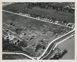 Fazendeville and the Chalmette National Cemetery and Chalmette monument, aerial view from southwest, 1963