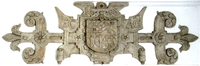 1608 strapwork plaster escutcheon of four quarters in upstairs bedroom of Ruxford Barton. Armorials 1&4: Chequy or and gules, a chief vair a mullet for difference (Chichester); 2: Argent, a chevron engrailed gules between three lion's faces azure a crescent for difference (Copleston of Eggesford); 3: Gules, a pair of wings conjoined ermine (de Reigny of Eggesford). With initials "EC" and "AC" for Edward Chichester, 1st Viscount Chichester (1568-1648) and his wife Anne Copleston (1588-1616) ChichesterEscutcheon 1608 RuxfordBarton Devon.PNG