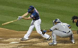 Kansas City Royals catcher and 5x Gold Glove winner Salvador Perez stands behind home plate during a 2013 game versus the New York Mets. Daniel Murphy and Salvador Perez on August 2, 2013.jpg