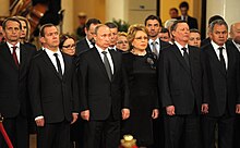 Putin with Sergei Ivanov, Dmitry Medvedev, Dmitry Kozak, Valentina Matviyenko, Elvira Nabiullina, Sergey Naryshkin, and Sergey Shoygu at the funeral of Yevgeny Primakov, 29 June 2015 Farewell to Yevgeny Primakov 20.jpg