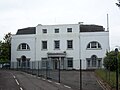 Front view of large white building