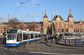 Line 26 tram running around a loop in front of Centraal station