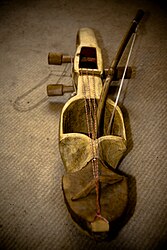 A sarangi instrument with its bow