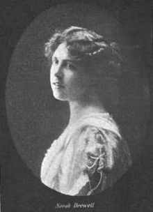 A portrait in an oval frame, of a young white woman wearing a dress with a lace collar.
