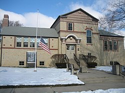 The Oregon Public Library in Oregon, Illinois, U.S.A. is an example of Arts and Crafts in a Carnegie Library.