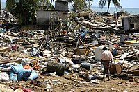 Man walking around in Ruins after Tsunami.