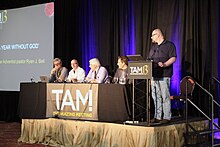 Saunders (left) in 2015, on the Podcaster Panel at TAM13 Podcast Panel TAM13.jpg
