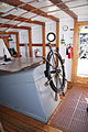 The wheelhouse of Sherman Zwicker, a wooden auxiliary schooner moored at the Maine Maritime Museum in Bath, Maine, USA