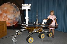 Sofi Collis with a model of Mars Exploration Rover Sofi Collis MER.jpg