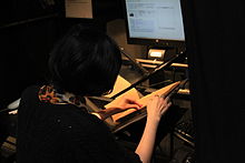 A woman scanning a book