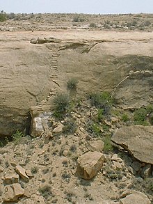 A color picture of two sets of steps cut deep into a cliff