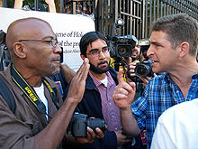 Two men argue at a political protest in New York City. Mahmoud Ahmadinejad at Columbia 6 by David Shankbone.jpg