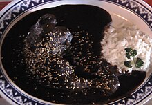 Mole sauce, which has dozens of varieties across the Republic, is seen as a symbol of Mexicanidad and is considered Mexico's national dish. Mole in Puebla.JPG