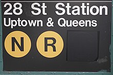 28th Street station after the W train was discontinued in mid-2010. Note the dark grey tape masked over the W bullet. (This sign has since been replaced due to the restoration of the W in 2016.) NYC MTA no W.jpg