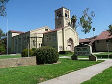 A school building with clock tower. An announcement board "South Pasadena Middle School" is visible.