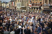 Civilians dancing in the square of Eindhoven, the first major town in Netherlands to be liberated. Eindhoven was later bombed by the German Luftwaffe. The Liberation of Eindhoven, Holland, 20 September 1944 TR2369.jpg