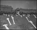 These markers are for the graves of 80 victims of the Nazis found in Ludwigslust. The entire population of Schwerin, Germany, was ordered by the Military Government to attend funeral rites conducted by U.S. Army chaplains. Schwerin, 8 May 1945