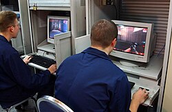 USS San Jacinto (CG-56) crewmembers playing the game, 2002 US Navy 021102-N-3235P-505 Crewmember assigned to the guided missile cruiser USS San Jacinto (CG 56) play Unreal Tournament.jpg