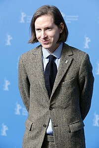 A picture of Wes Anderson smiling towards the camera