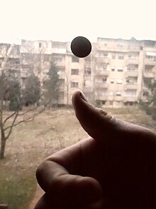 Flipping a coin leads to two outcomes that are almost equally likely. Coin tossing.JPG