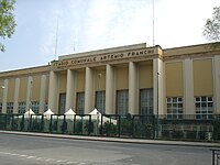 The monumental entrance of the stadium, the same as in 1931 except for the inscription