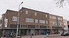 Woning- en winkelcomplex in de stijl van de Amsterdamse School