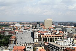 Typically dense cityscape of Leipzig old town, view from the new town hall. Buildings from left to right: Gondwanaland of Leipzig Zoo; St. Thomas Church; headquarters of Sparkasse Leipzig Bank; the Westin Hotel; and Museum of Fine Arts to the right. Leipzig (Rathausturm, Neues Rathaus) 11 ies.jpg