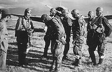 Manchukuo Imperial Air Force pilots with a Nakajima Ki-27 behind, 1942 Manchukuo Air Force.JPG