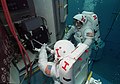 Astronauts practice changing out the Hubble Space Telescope's Wide Field Planetary Camera.