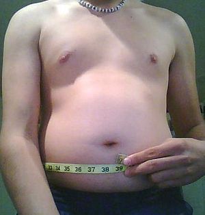 On overweight man's waistline.