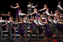 A show choir competing on stage