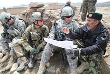 U.S. Army soldiers in May 2011, wearing the ACU in the Universal Camouflage Pattern, along with its replacement MultiCam pattern (second from left) in Paktika province, Afghanistan 101st Airborne and ANA Operation Overlord meeting.jpg