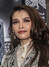 A headshot of KZ Tandingan