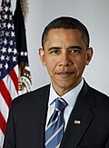 Head and shoulders portrait of President Barack Obama in his forties with close-cropped hair in a business suit, a flag-pin, and a striped tie with the U.S. and presidential flag in the background over his right shoulder