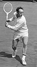Rod Laver playing a backhand stroke