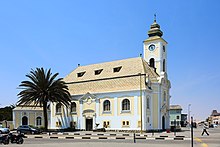 Lutheran church in Swakopmund. Owing to German and Finnish missionary efforts, Lutheranism is the religious affiliation of almost half of the Namibian population. Swakopmund ev-luth Kirche 1.jpg