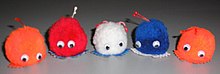 Five weepul toys in various colors