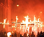 A photograph of people carrying flaming martyrs crosses in Lewes during the bonfire night celebration